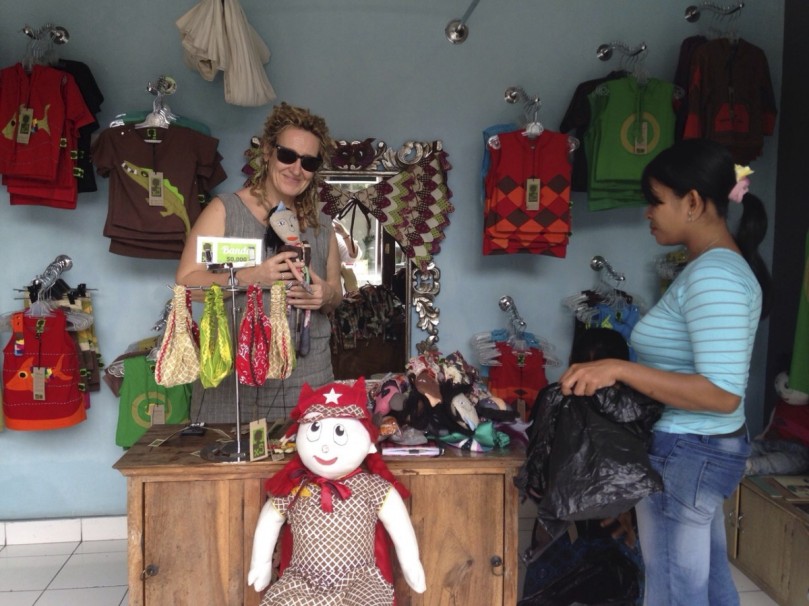 Finding Local Handicrafts, in this case some handmade animal dolls made from recycled materials by a fair trade womens initiate in the local village.
